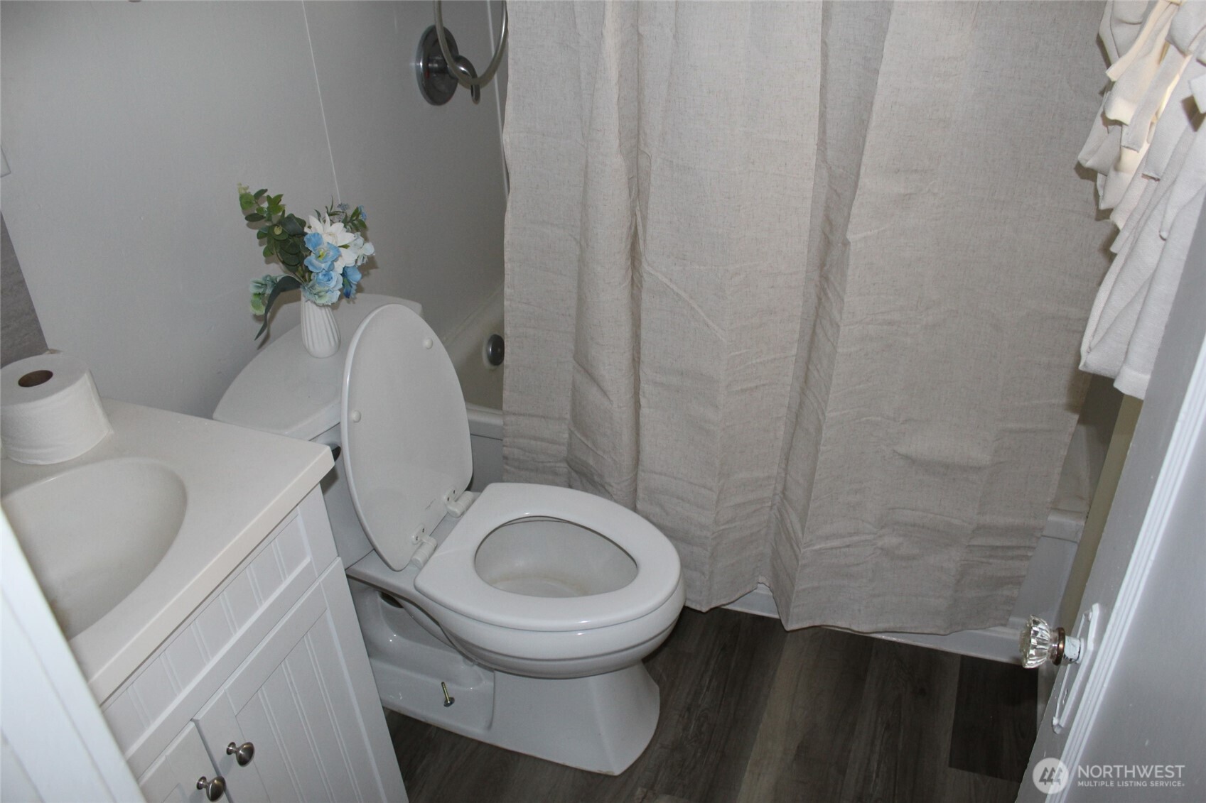 512 West Broadway Avenue Ritzville, WA 99169 - Photo 16 of 16 a white toilet sitting next to a small sink