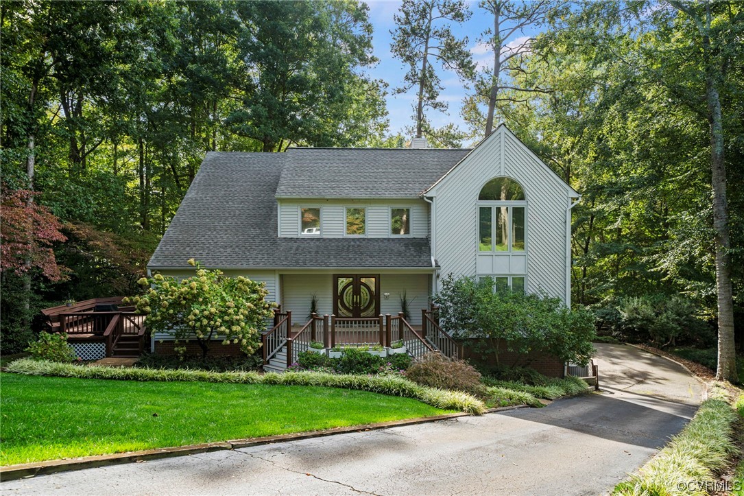 13703 Beechwood Point Road Midlothian, VA 23112 - Photo 3 of 50 a front view of a house with a garden