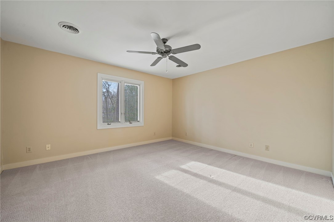 13703 Beechwood Point Road Midlothian, VA 23112 - Photo 32 of 50 an empty room with windows and fan
