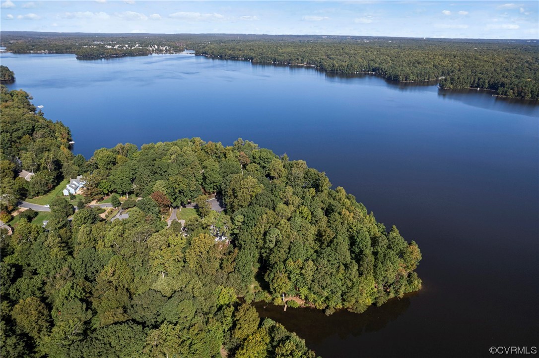 13703 Beechwood Point Road Midlothian, VA 23112 - Photo 48 of 50 a view of a lake with a field
