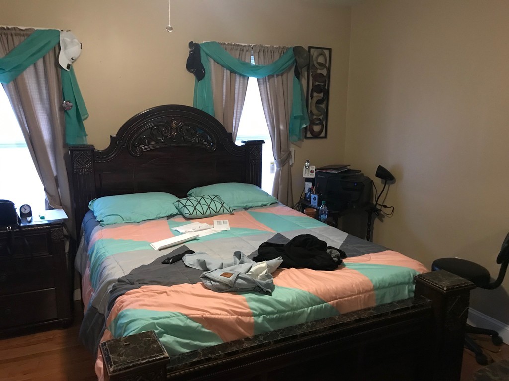 71 Birch Street Worcester, MA 01603 - Photo 12 of 23 a bedroom with a bed and a dresser