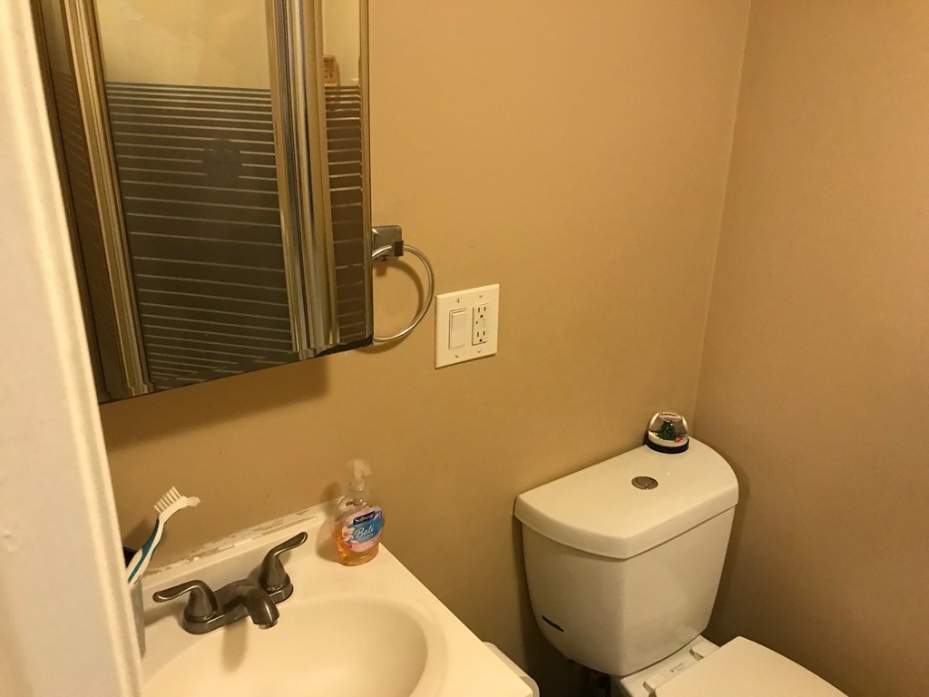 71 Birch Street Worcester, MA 01603 - Photo 14 of 23 a bathroom with a sink and a toilet