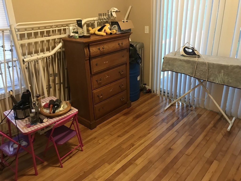 71 Birch Street Worcester, MA 01603 - Photo 15 of 23 a view of a bedroom with furniture and wooden floor