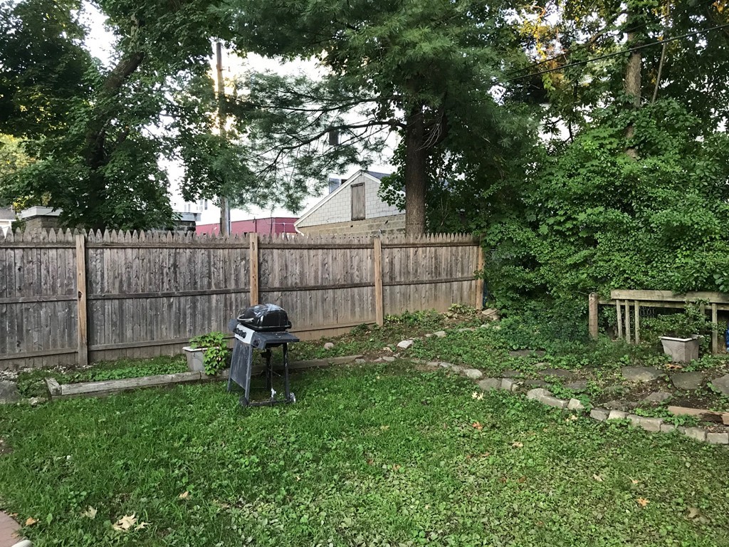 71 Birch Street Worcester, MA 01603 - Photo 19 of 23 a view of a backyard with table and chairs