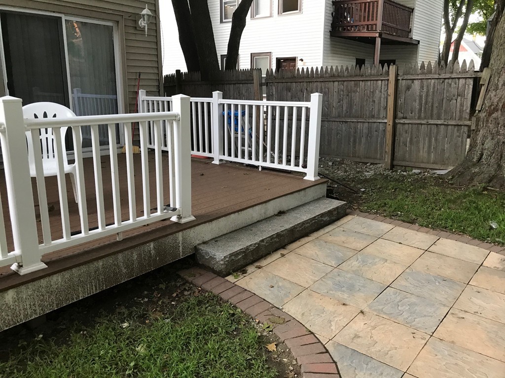 71 Birch Street Worcester, MA 01603 - Photo 20 of 23 a view of a backyard with pathway