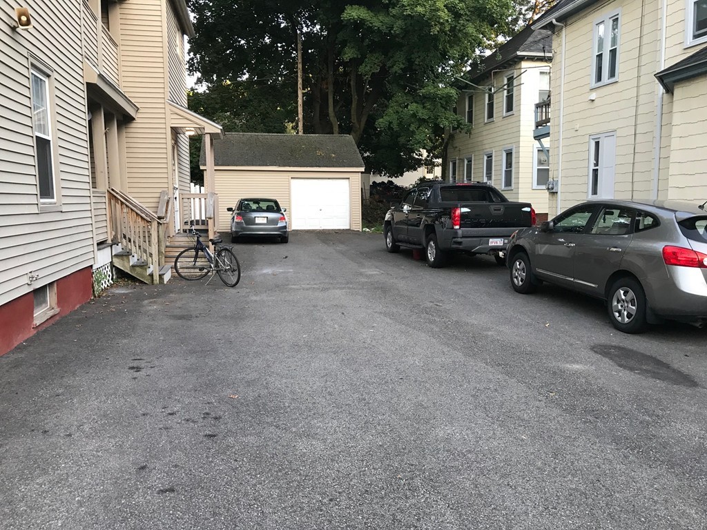 71 Birch Street Worcester, MA 01603 - Photo 22 of 23 a car parked in front of a house