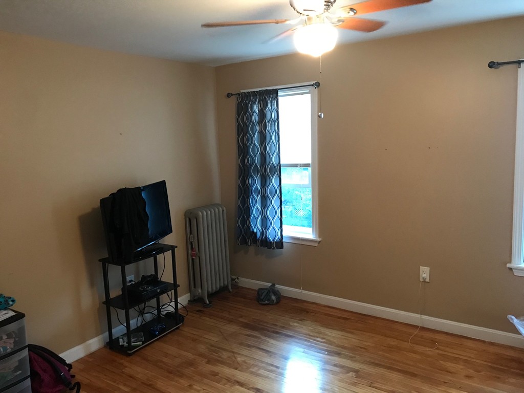 71 Birch Street Worcester, MA 01603 - Photo 6 of 23 a view of room with window and wooden floor