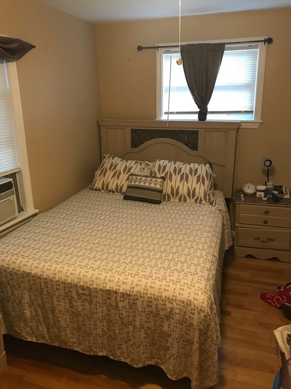 71 Birch Street Worcester, MA 01603 - Photo 9 of 23 a bedroom with a bed and a window