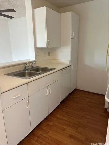 a kitchen with a sink and cabinets