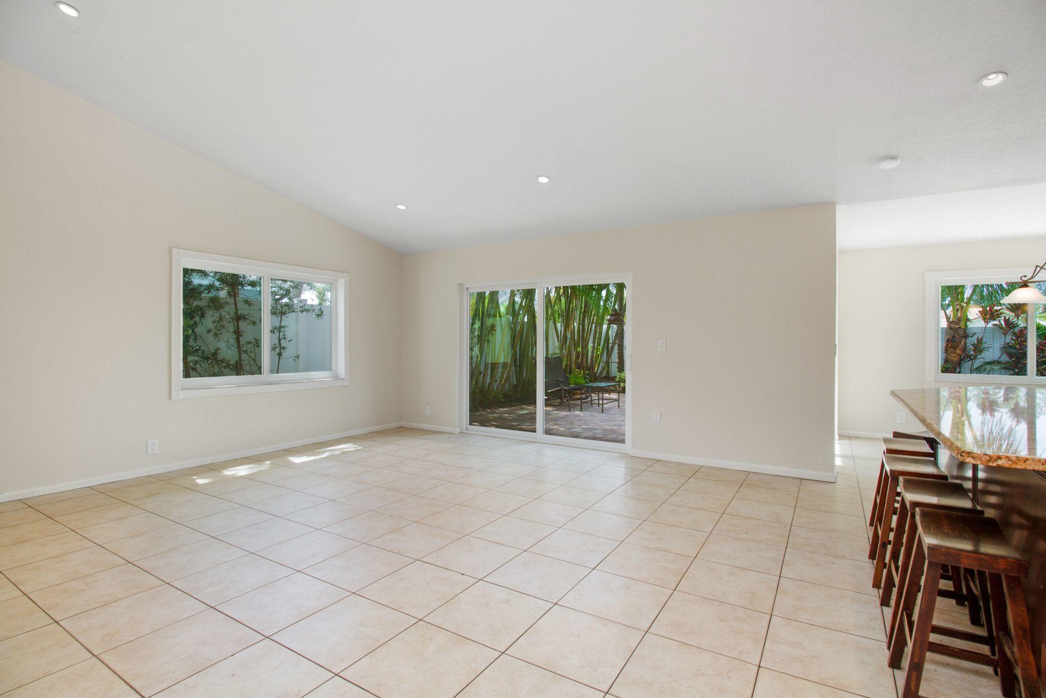 6298 Amberwoods Drive Boca Raton, FL 33433 - Photo 13 of 33 6298 AMBERWOODS FAMILY ROOM AND KITCHEN