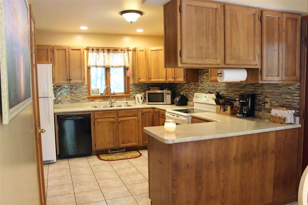 3385 Mertz Road Caro, MI 48723 - Photo 9 of 22 Updated kitchen with a new backsplash and new countertops