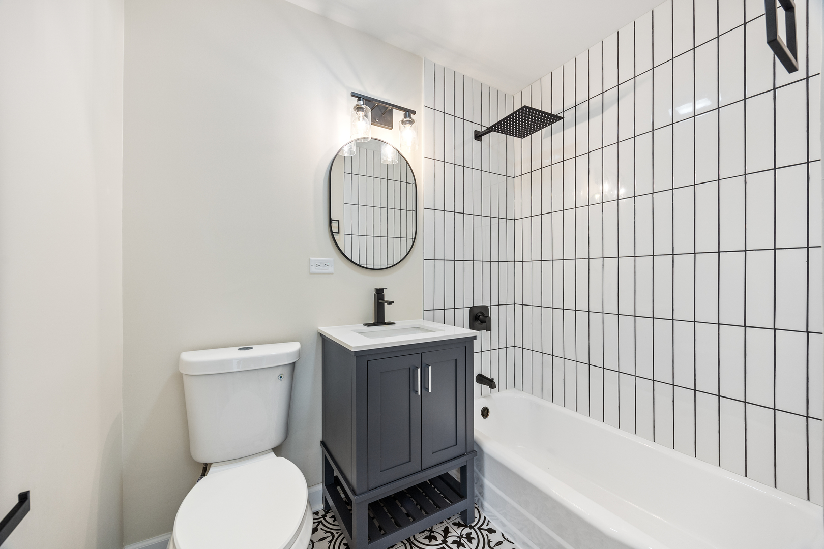 5821 Warren Street Morton Grove, IL 60053 - Photo 17 of 27 a bathroom with a toilet sink and shower