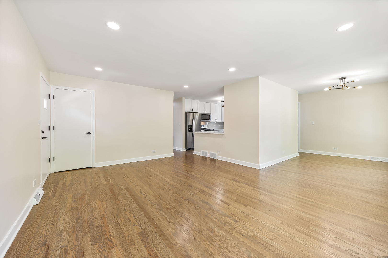 5821 Warren Street Morton Grove, IL 60053 - Photo 6 of 27 a view of empty room with wooden floor