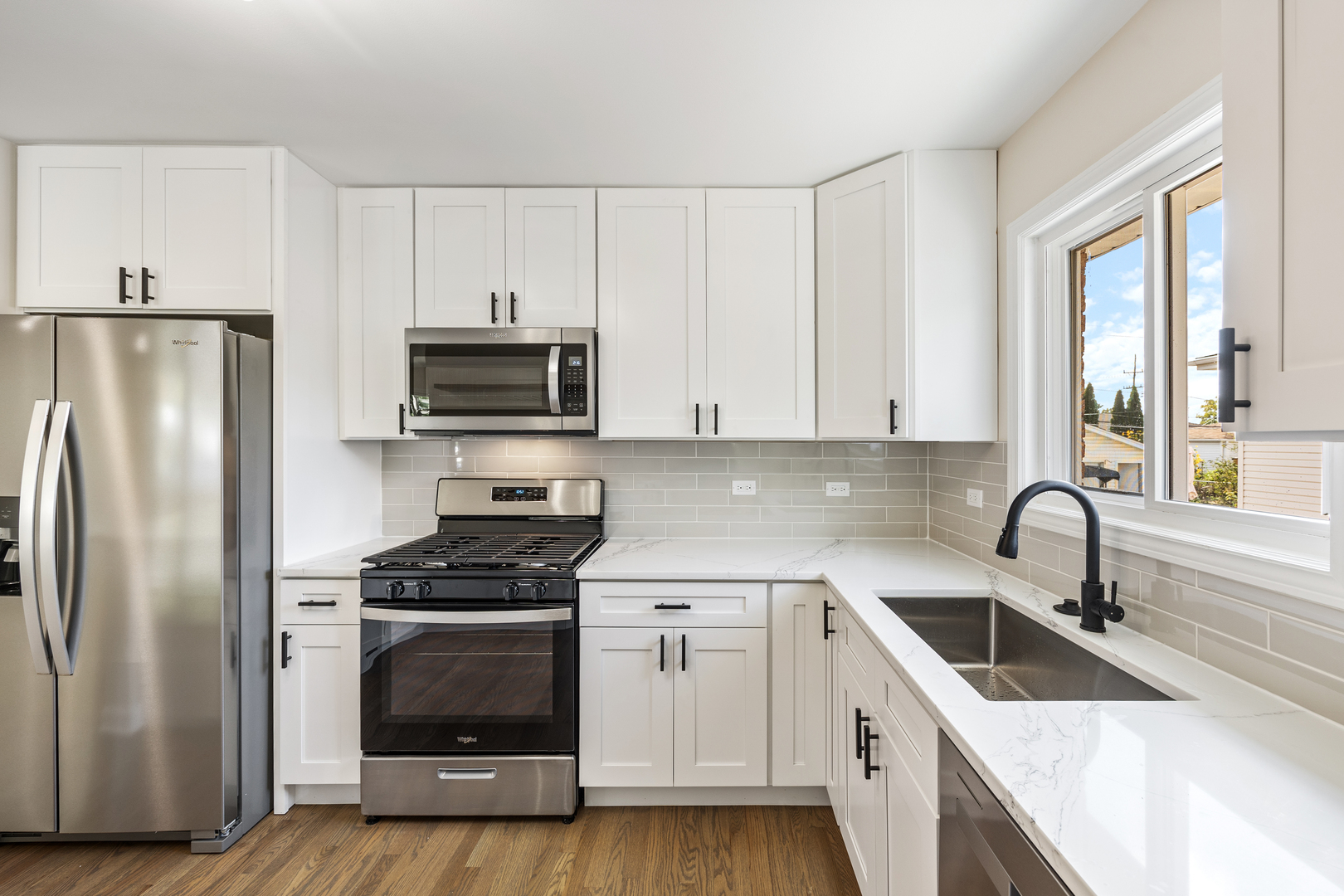 5821 Warren Street Morton Grove, IL 60053 - Photo 10 of 27 a kitchen with a sink stove and refrigerator