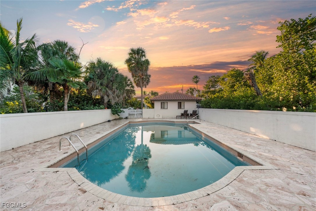 16632 Captiva Drive Captiva, FL 33924 - Photo 11 of 38 a view of a swimming pool with a sitting space