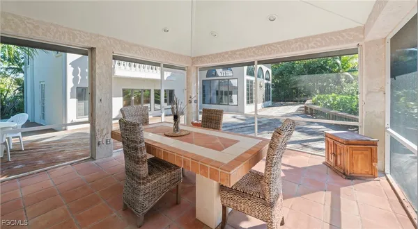a view of a backyard with a sitting area