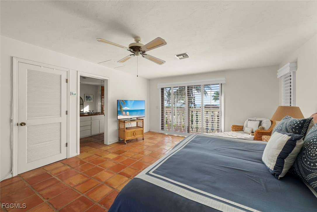 16632 Captiva Drive Captiva, FL 33924 - Photo 18 of 38 a bed room with a bed and a television