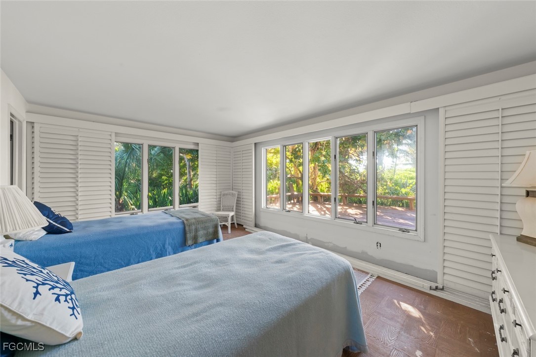 16632 Captiva Drive Captiva, FL 33924 - Photo 22 of 38 a bed sitting in a bedroom next to a window