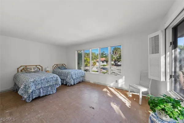 a spacious bathroom with a granite countertop sink mirror and bathtub