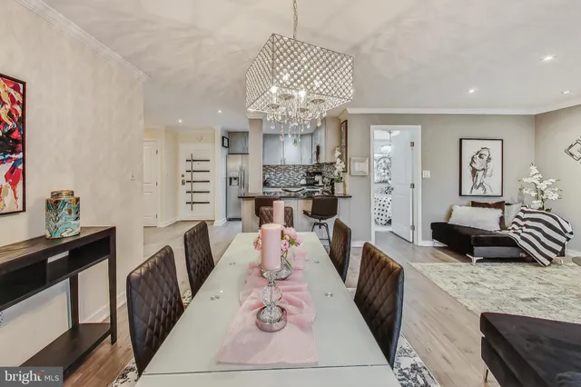 a large kitchen with a table and chairs