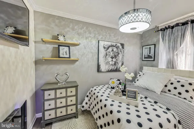 a bedroom with furniture and window