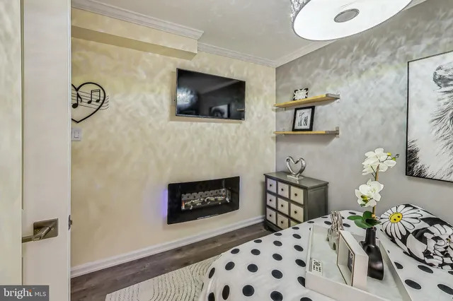 a bedroom with a bed and a fireplace