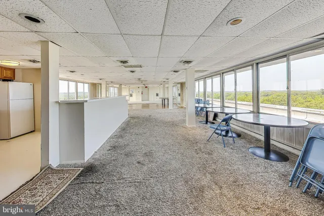 a view of a kitchen with furniture and windows