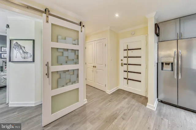 a view of kitchen with furniture and wooden floor