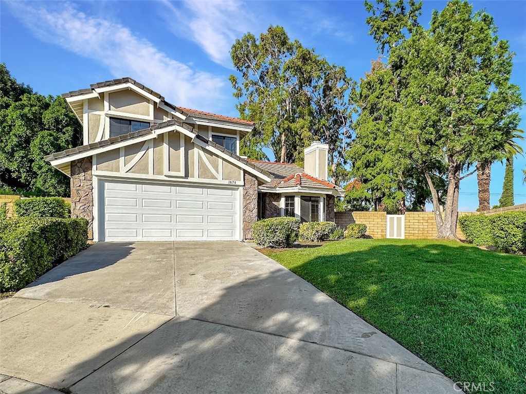 2678 Hampton Way Riverside, CA 92506 - Photo 1 of 1 a front view of a house with a garden