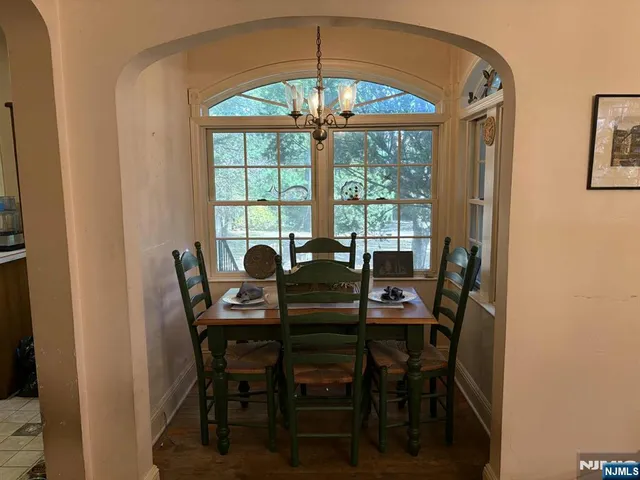 a view of a dining room with furniture and window