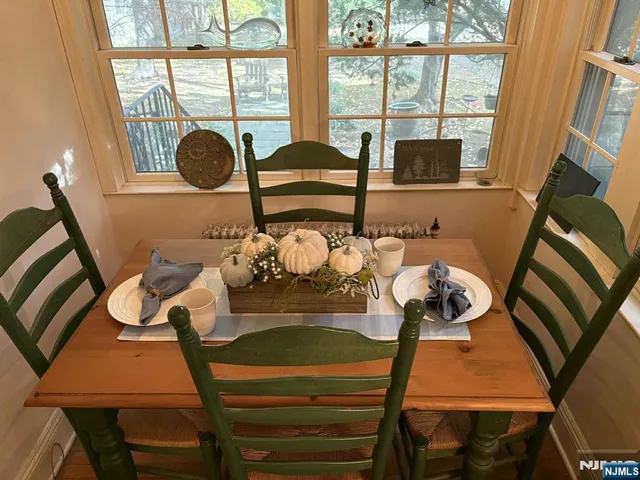 a view of a dining room with furniture a chandelier