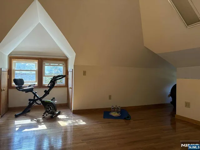 a view of workspace with wooden floor and windows