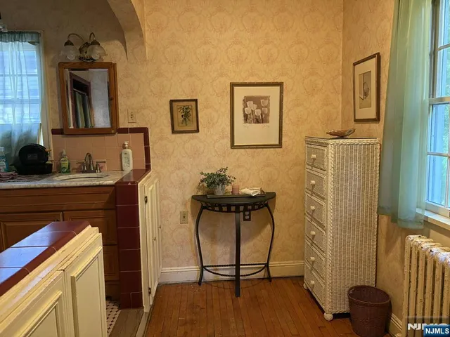 a view of a bathroom with a sink and a mirror