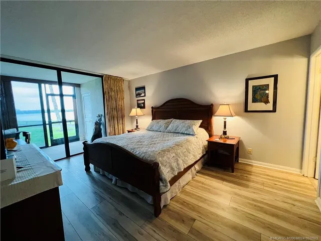 a bathroom with a sink vanity granite and toilet