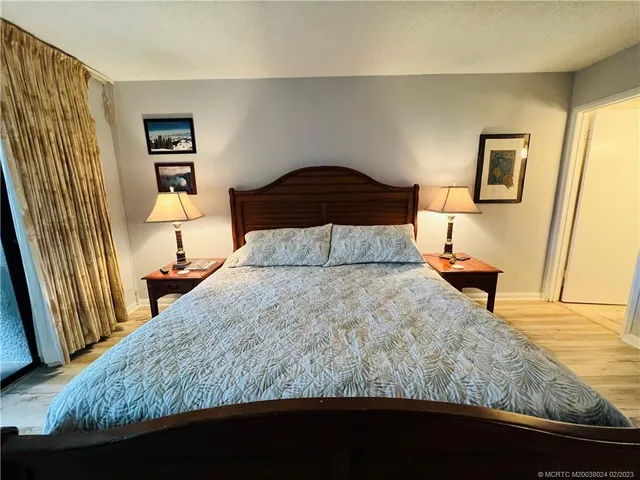 a bathroom with a sink mirror vanity and toilet