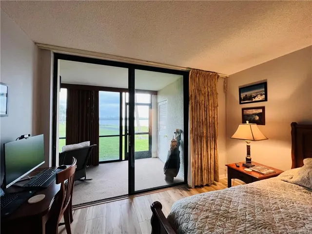 a view of a patio with a table and chairs