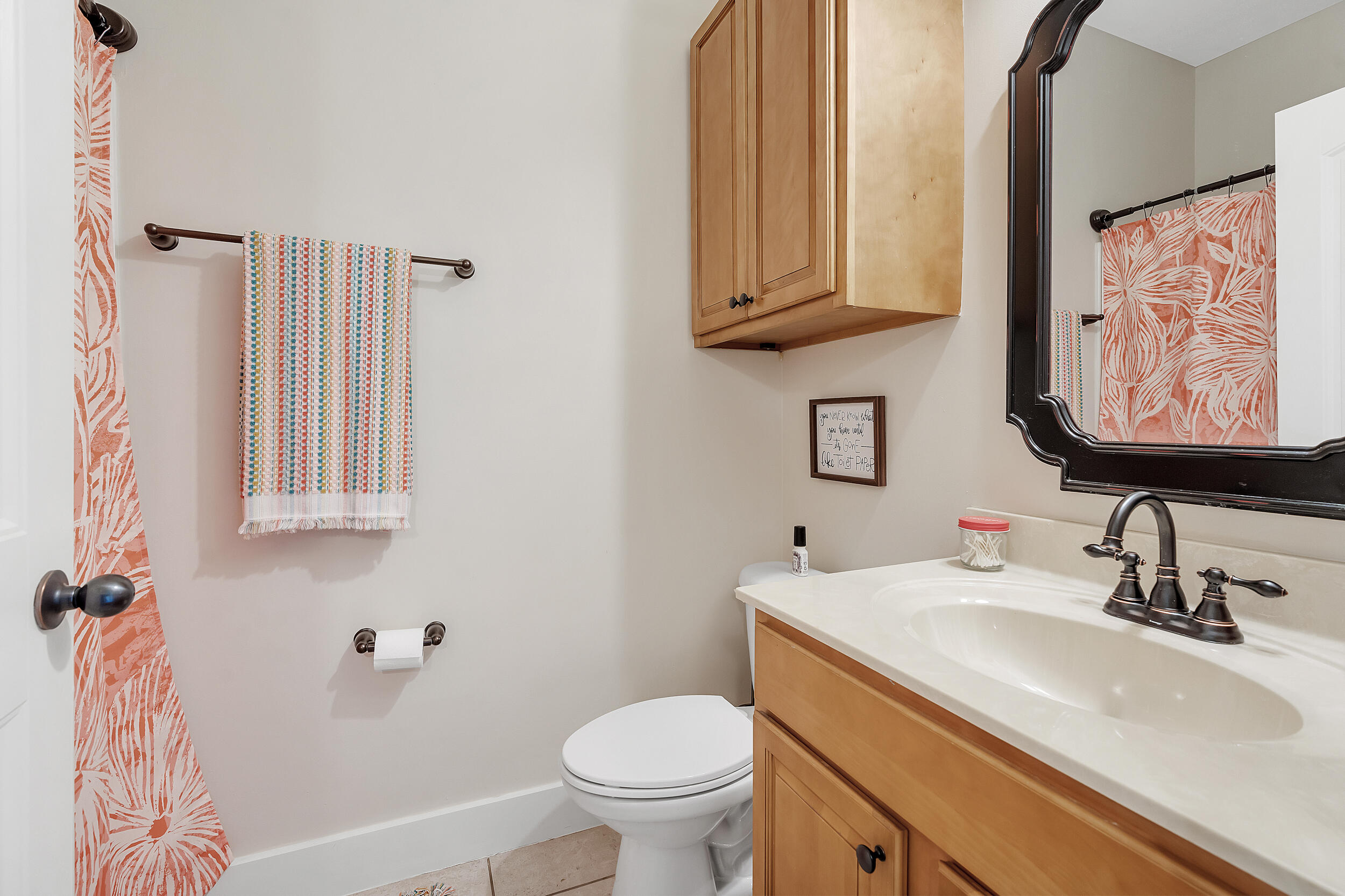719 Earl Godwin Road Freeport, FL 32439 - Photo 17 of 23 a bathroom with a sink toilet and vanity