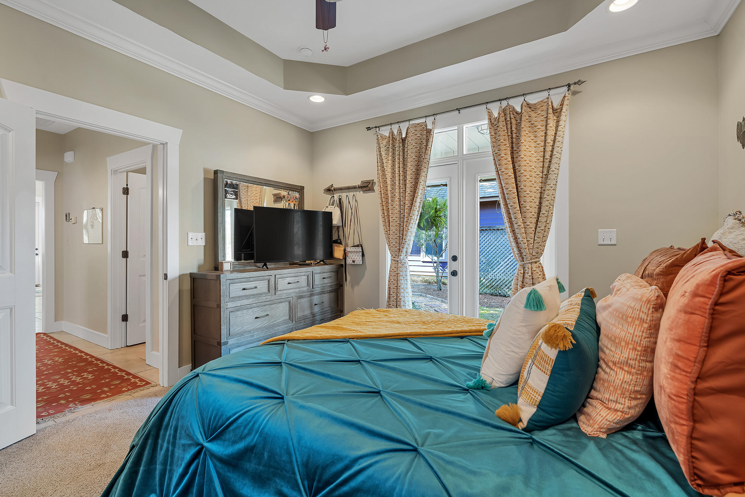 719 Earl Godwin Road Freeport, FL 32439 - Photo 18 of 23 a bedroom with a bed and a flat screen tv