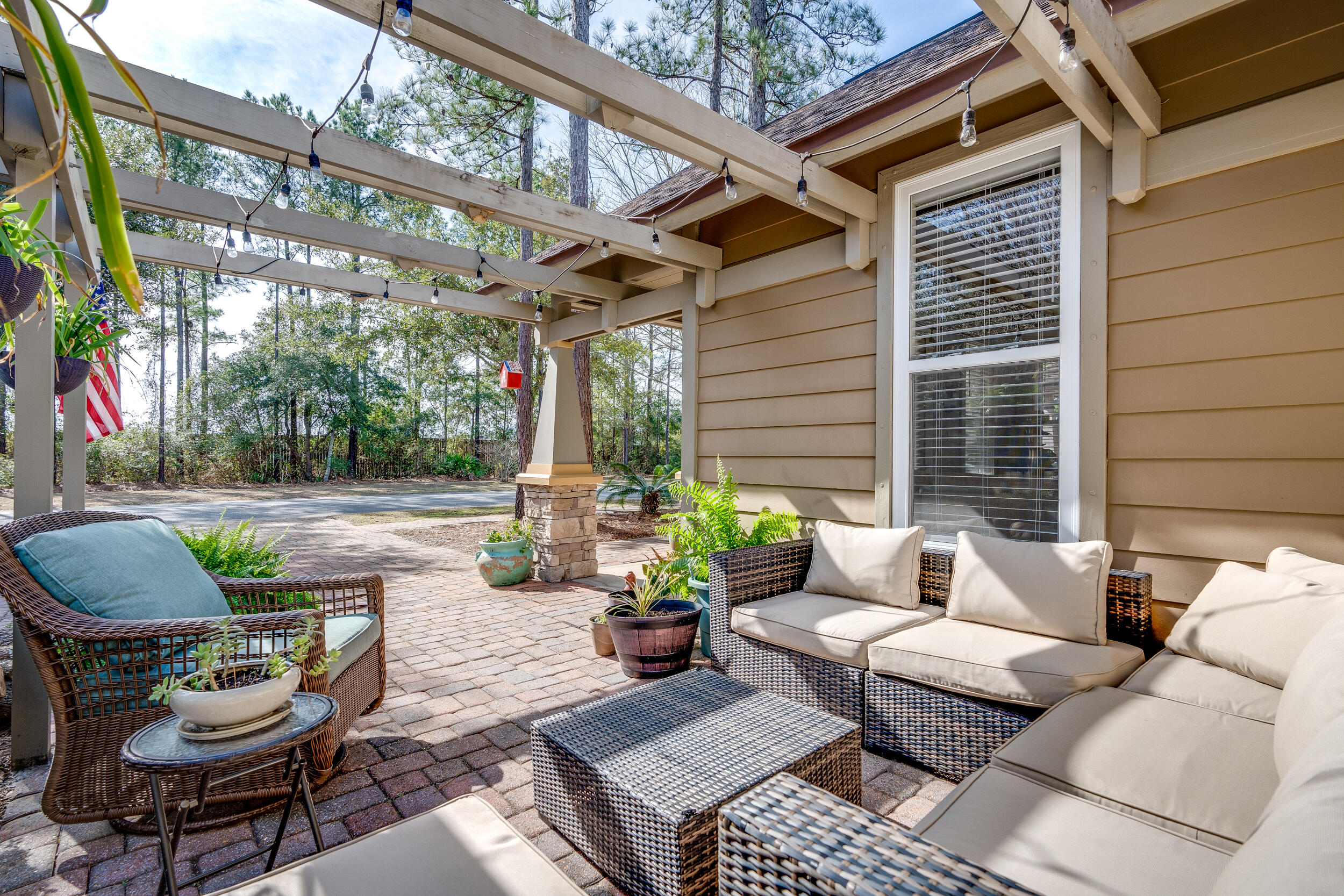 719 Earl Godwin Road Freeport, FL 32439 - Photo 3 of 23 a view of a patio with couches and a table and chairs with garden view