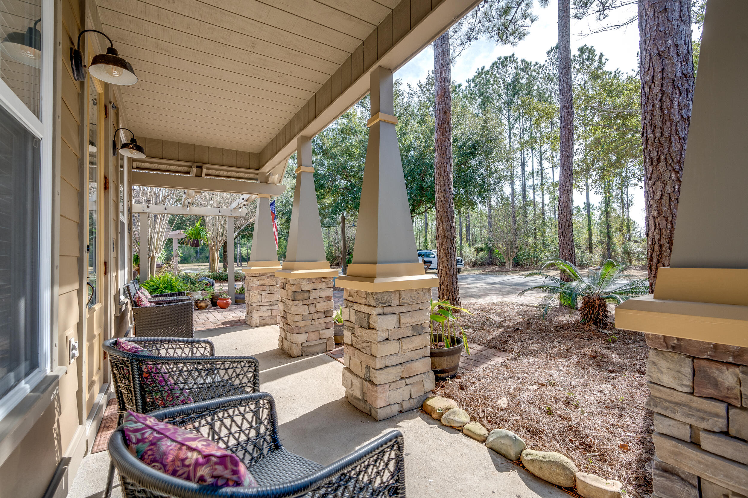 719 Earl Godwin Road Freeport, FL 32439 - Photo 4 of 23 a outdoor space with patio the couches and a dining table with garden view