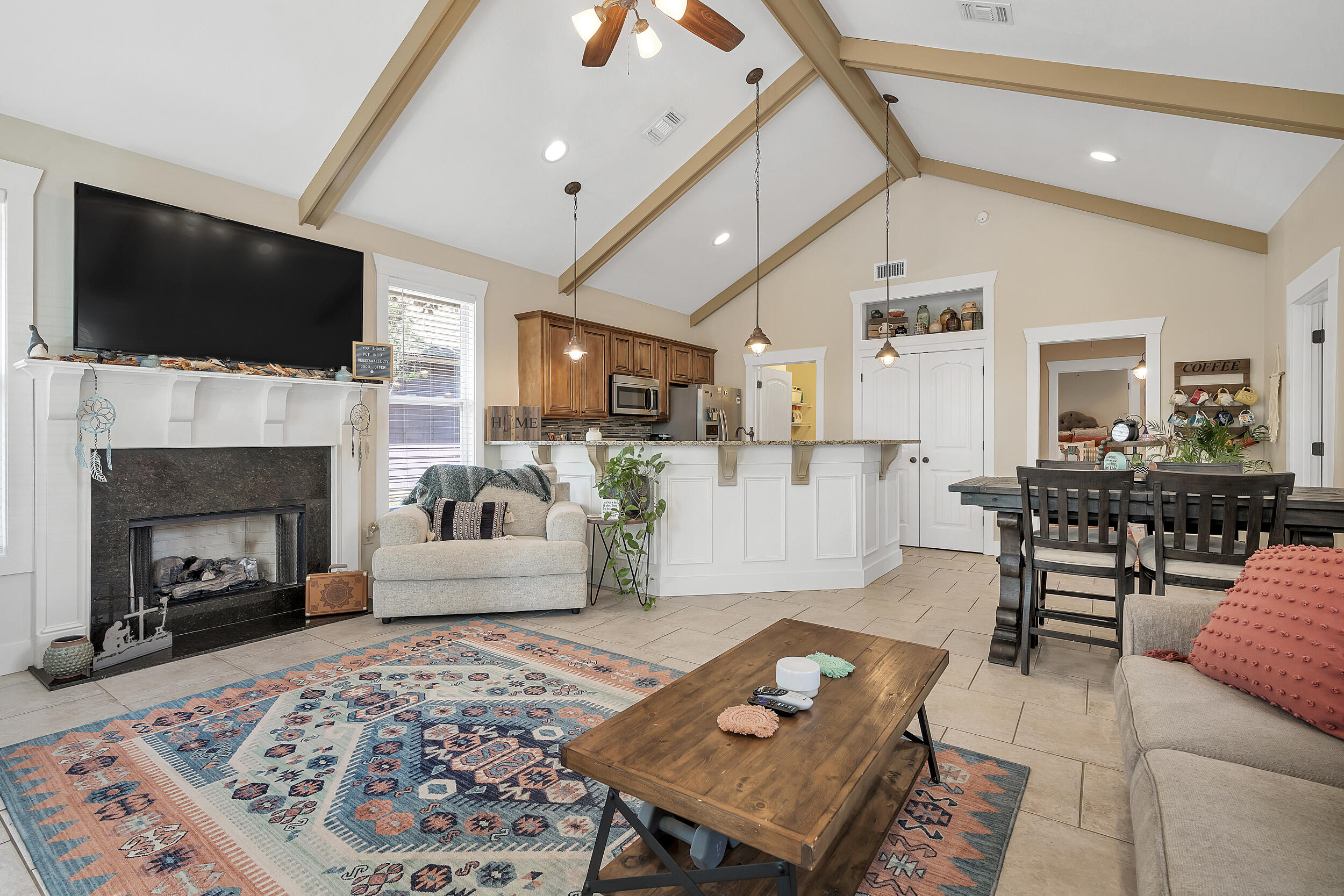 719 Earl Godwin Road Freeport, FL 32439 - Photo 5 of 23 a living room with furniture fireplace and flat screen tv