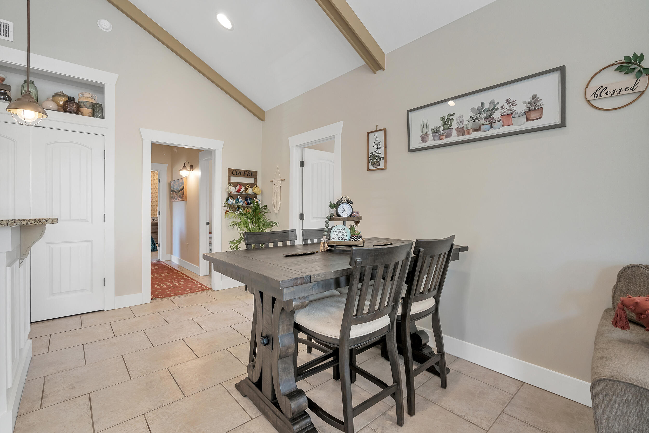 719 Earl Godwin Road Freeport, FL 32439 - Photo 8 of 23 a view of a dining room with furniture and wooden floor