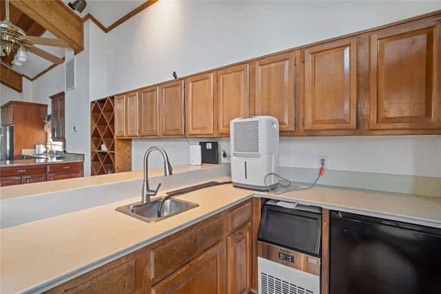 a room with a cabinets and a ceiling fan