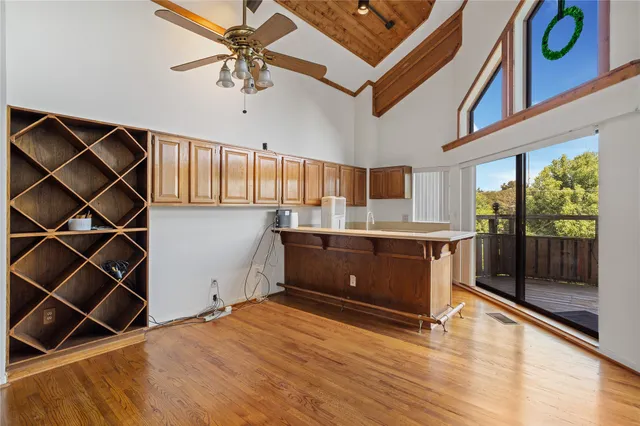 a kitchen with stainless steel appliances granite countertop a stove and cabinets