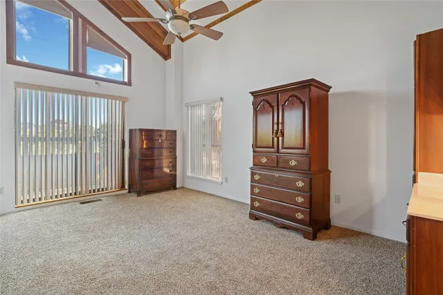 a kitchen with a sink refrigerator and cabinets