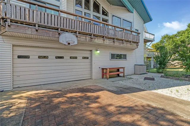 a view of a yard with plants and trees