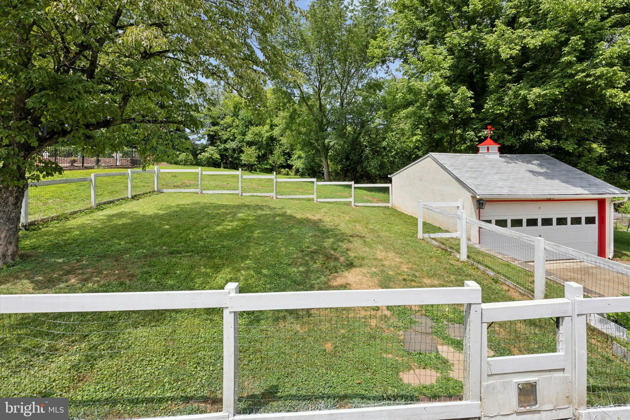110 North State Road Springfield, PA 19064 - Photo 21 of 25 White picket fenced-in backyard