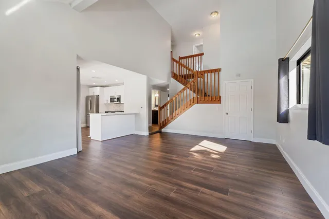 a bathroom with a sink vanity and mirror