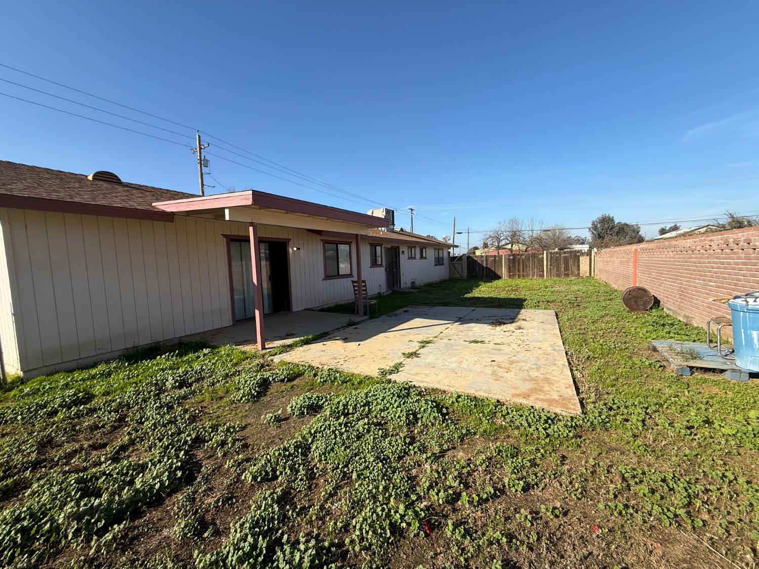 16385 North D Street Madera, CA 93638 - Photo 15 of 26 a view of a house with a backyard
