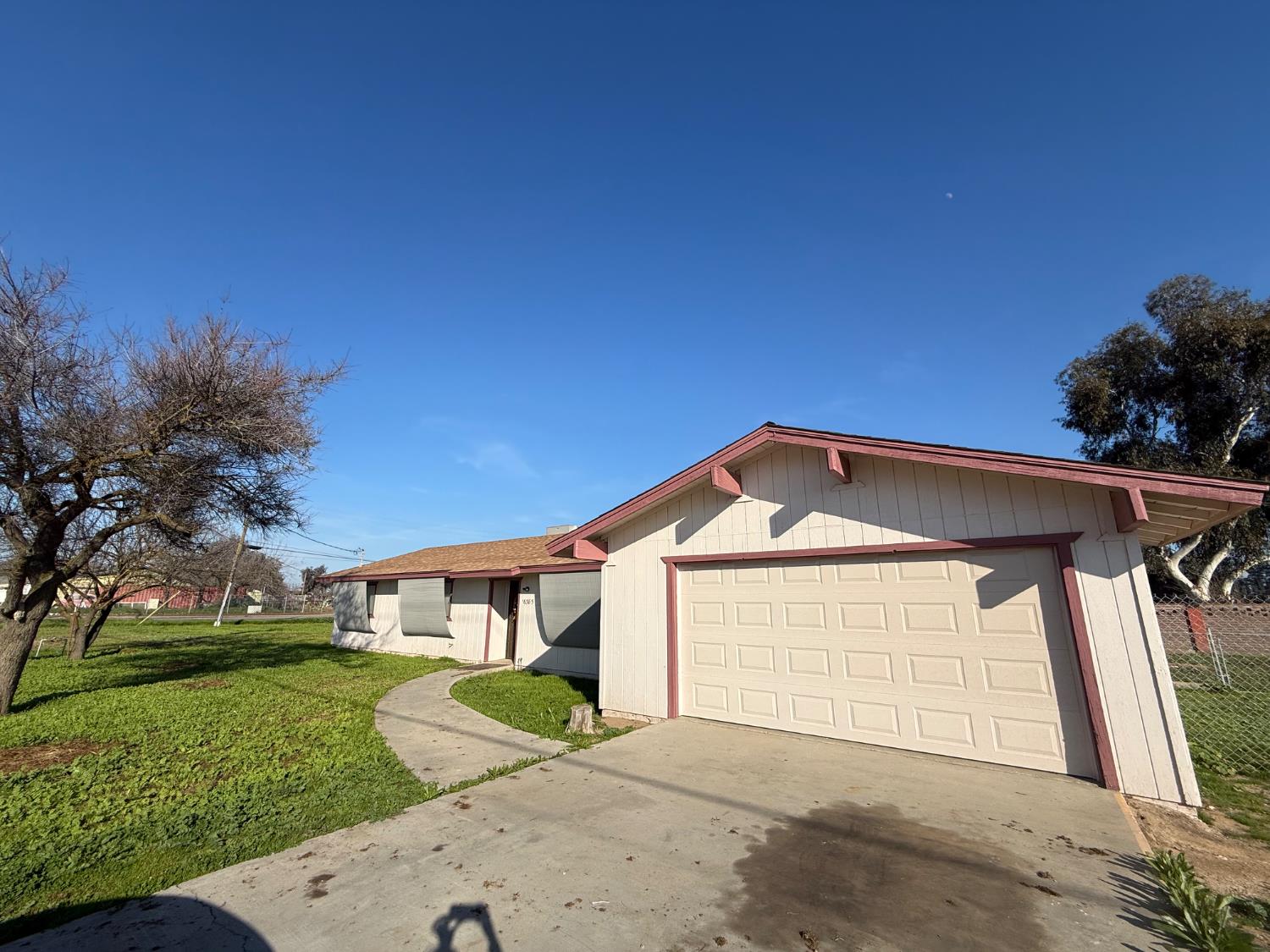 16385 North D Street Madera, CA 93638 - Photo 25 of 26 a front view of a house with a yard